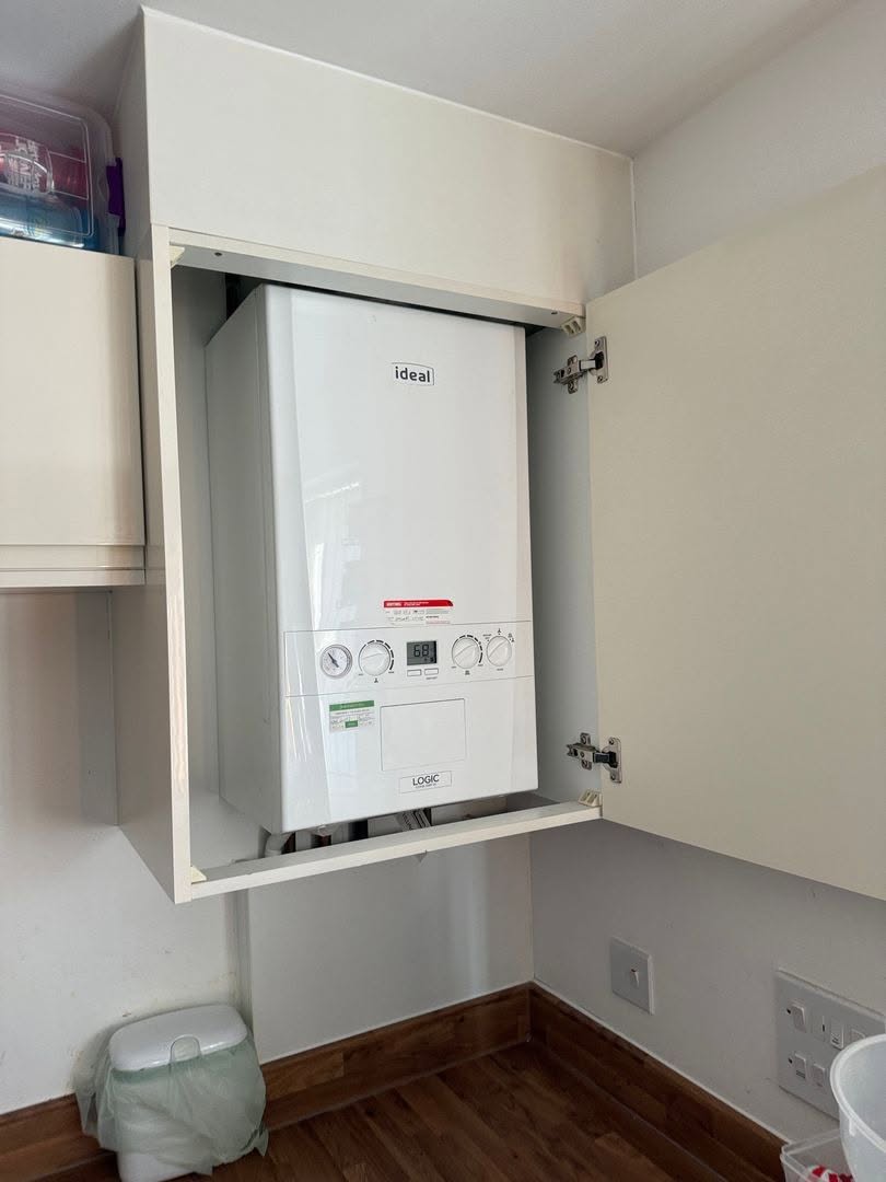 Ideal combi boiler fitted inside cupboard